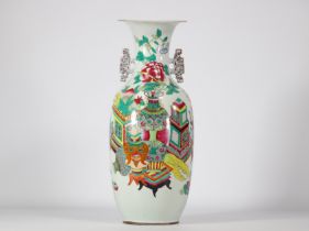 Famille rose porcelain vase decorated with different coloured furniture from the 19th century