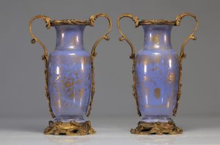 (2) Rare pair of blue porcelain vases with gilding and floral motifs and a Louis XV period bronze fr