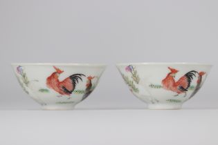 (2) Pair of Famille Rose mugs decorated with warm-colored roosters on a white background from 19th c