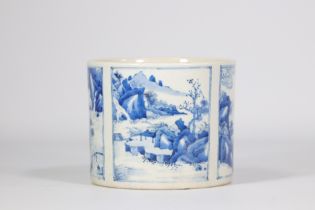 Blue and white brush pot decorated with several mountain scenes and figures from 19th century