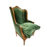Emerald green armchair in carved wood in the Louis XVI style