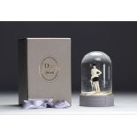 Christian Dior. 1997. Snow globe with golden star flakes featuring a customer from the Avenue Montai