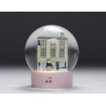 Bonpoint. Snow globe representing the famous Parisian boutique on rue de Tournon with the Cerise dol