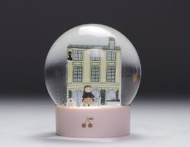 Bonpoint. Snow globe representing the famous Parisian boutique on rue de Tournon with the Cerise dol