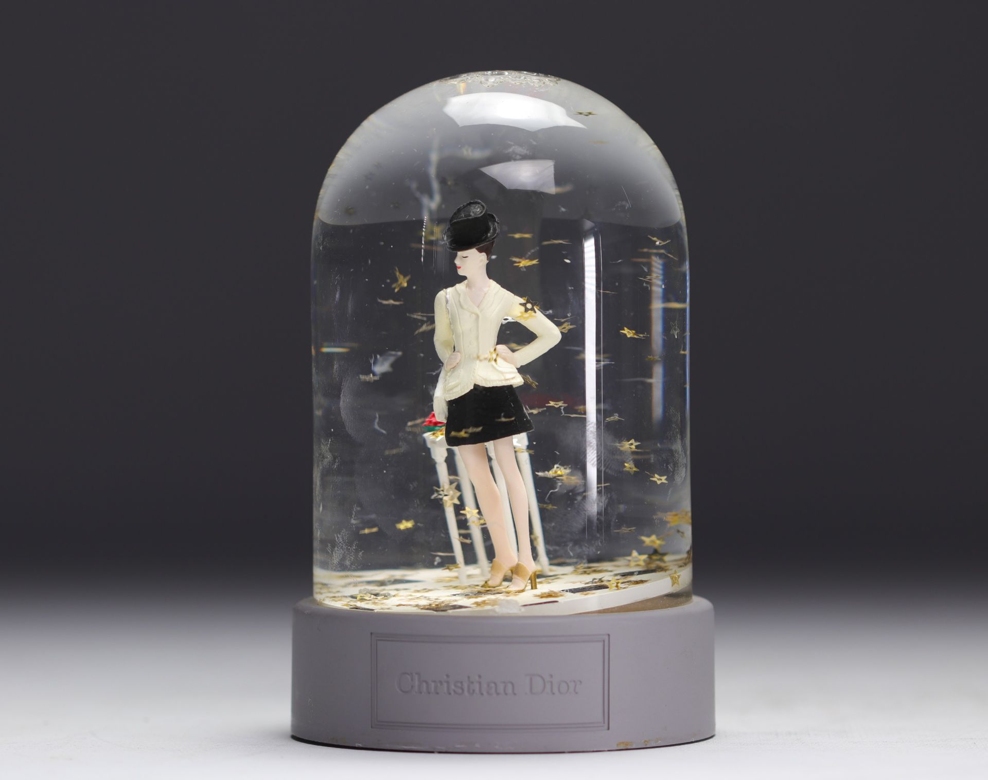 Christian Dior. 1997. Snow globe with golden star flakes featuring a customer from the Avenue Montai - Image 3 of 3