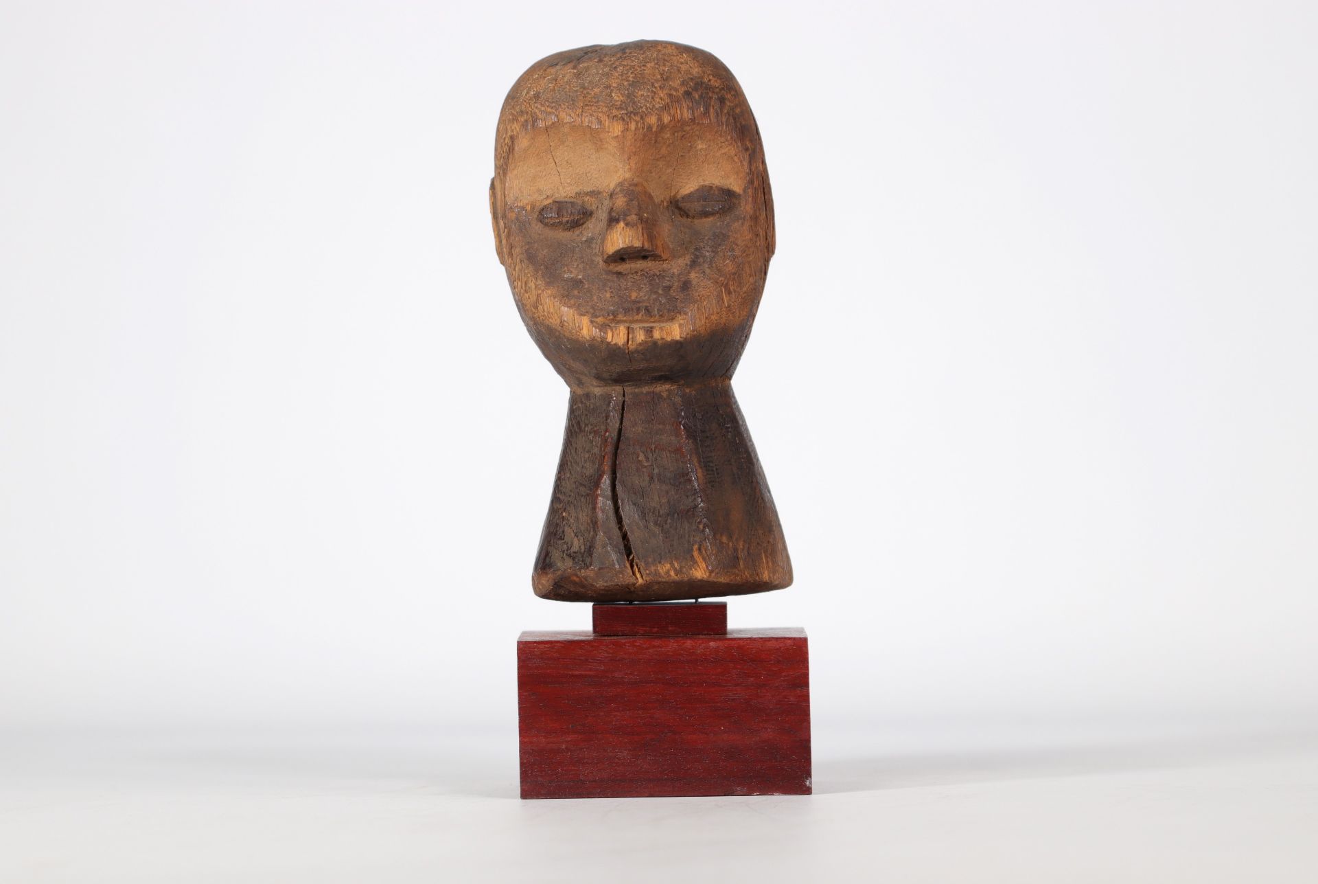 Carved wooden Lega statue on base