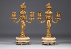 (2) An attractive pair of gilt bronze candlesticks with cherubs from the Napoleon III period