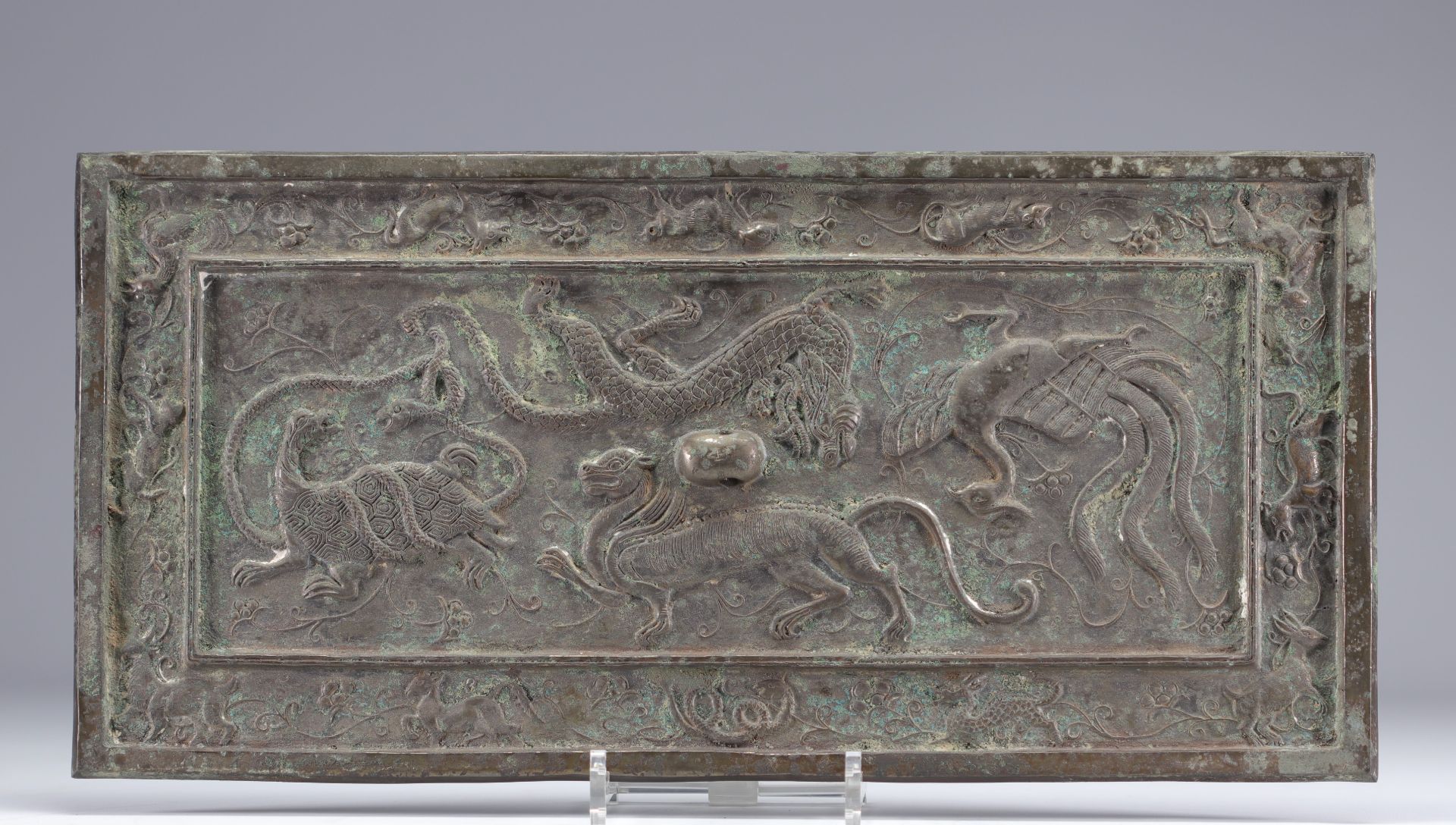 Bronze plaque decorated with animals in relief originating from Asia from 19th century