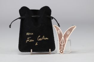 Jean Cocteau (1889-1963). 1958-1959. "Ve" 5th Variant. V-shaped pendant in white and brown inlaid