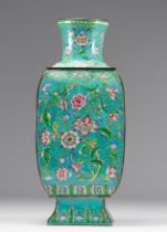 Cloisonne vase on a green background decorated with flowers Chinese work circa 1900