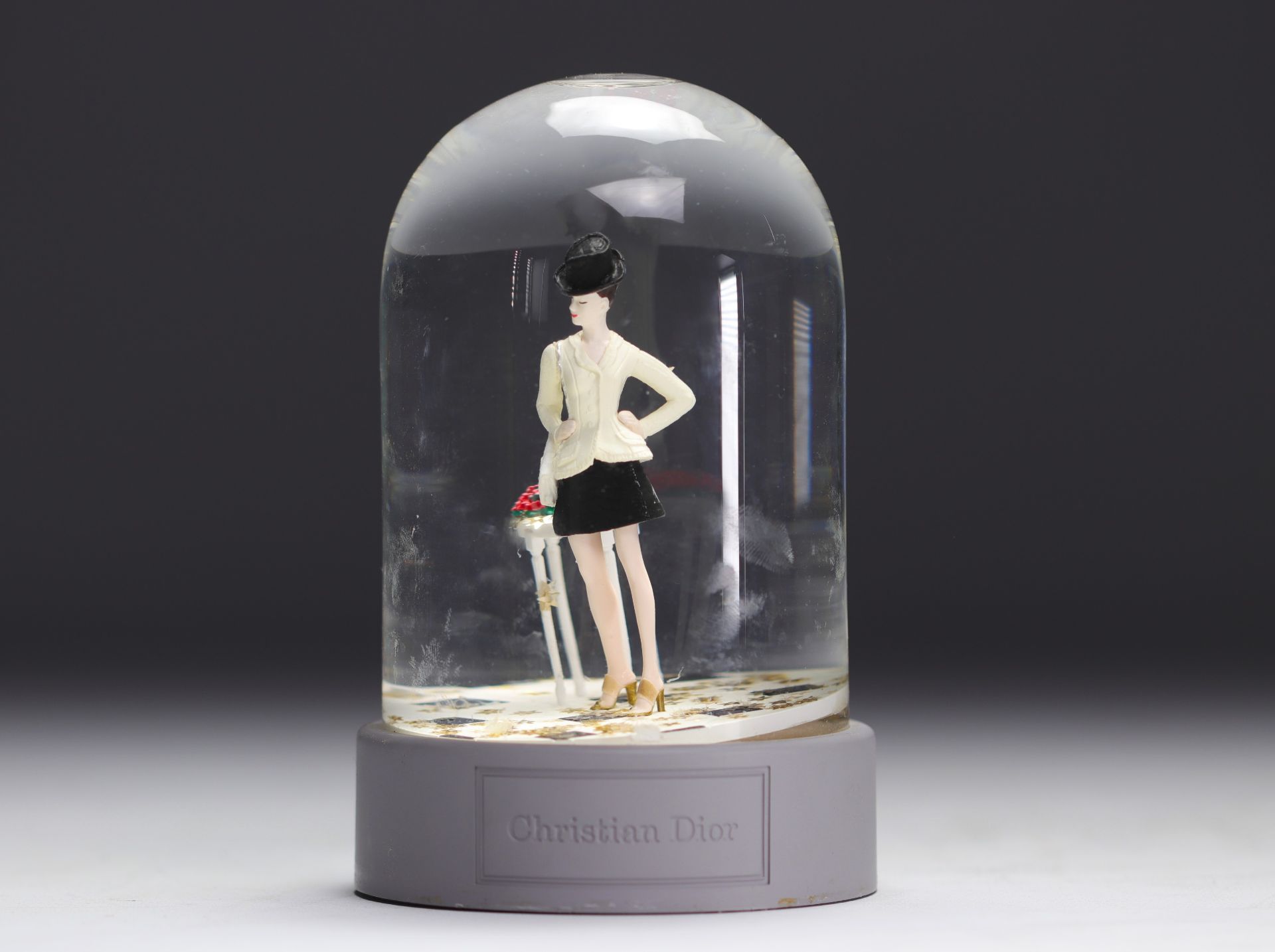 Christian Dior. 1997. Snow globe with golden star flakes featuring a customer from the Avenue Montai - Image 2 of 3