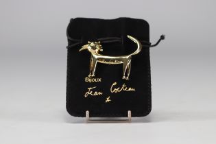 Jean Cocteau (1889-1963). "Kitten". Gilt metal and enamel brooch. Signed "Jean Cocteau" on the front