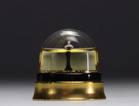 Jean Paul Gaultier. Snow globe adorned with gold sequins representing a woman.