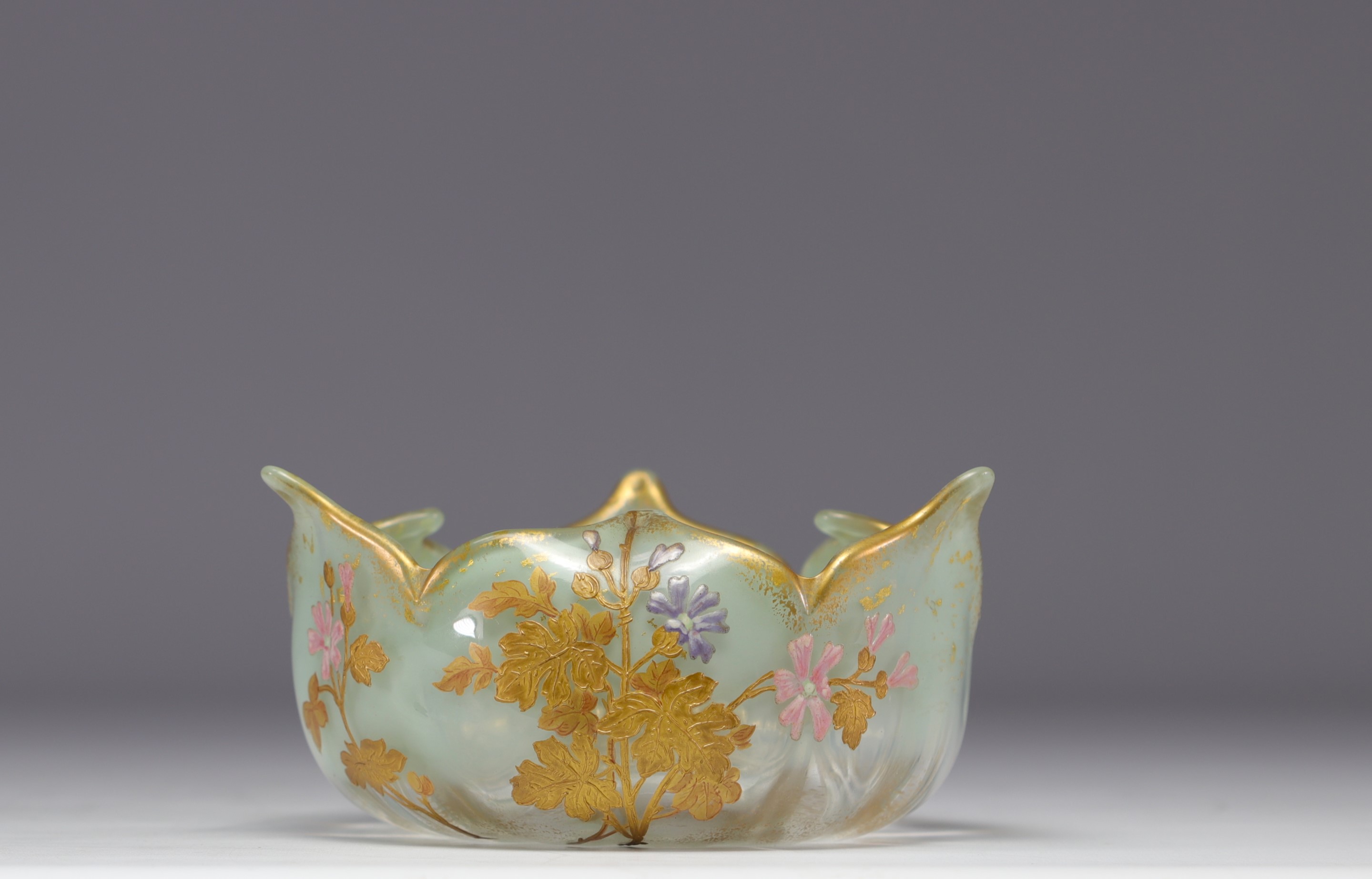 MONTJOIE, enameled three-lobed bowl with yellow and pink floral design on a green water background.