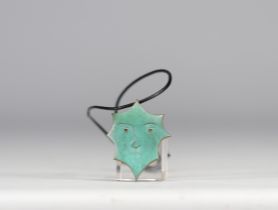 Jean Cocteau. "Octogone". Pendant in polished bronze with celadon patina, black enamel in the eyes