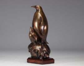 Penguin in bronze on a wooden base