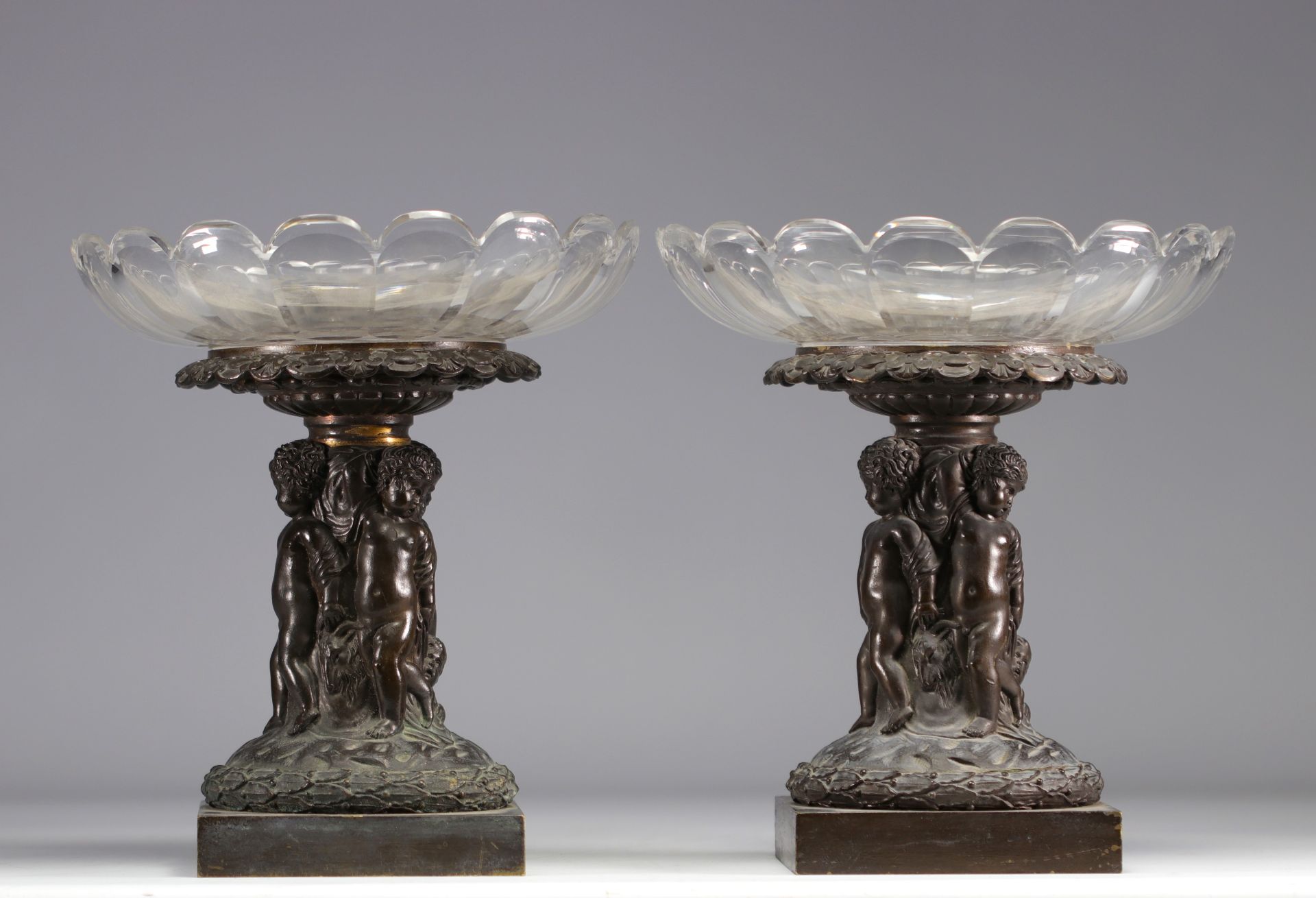 (2) Pair of large crystal bowls on bronze feet depicting a group of children from 19th century