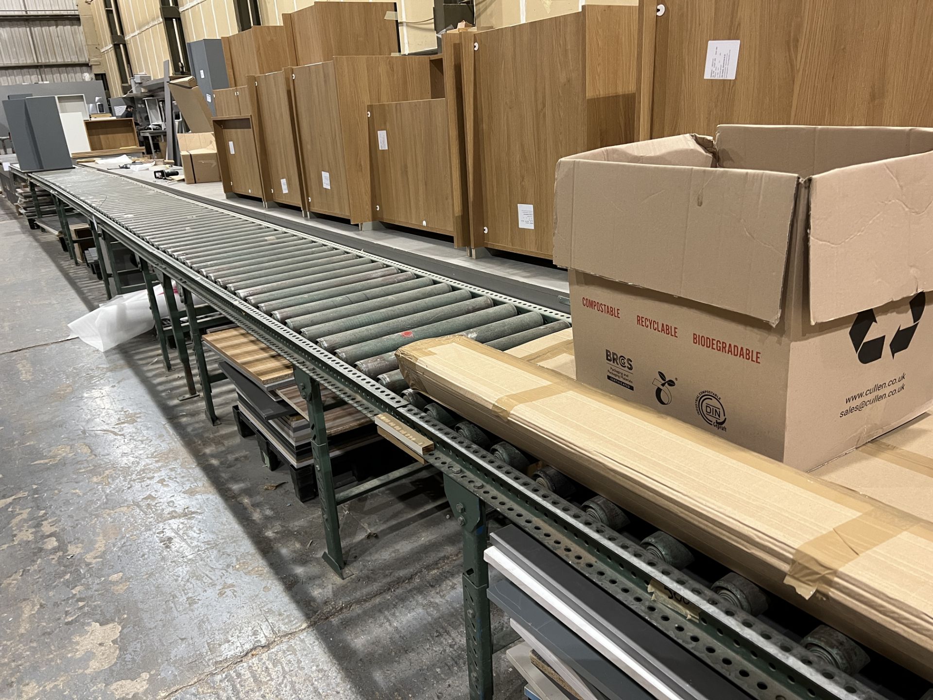 Two runs of gravity roller conveyor, total length 26 m x 600mm wide, location Unit 4