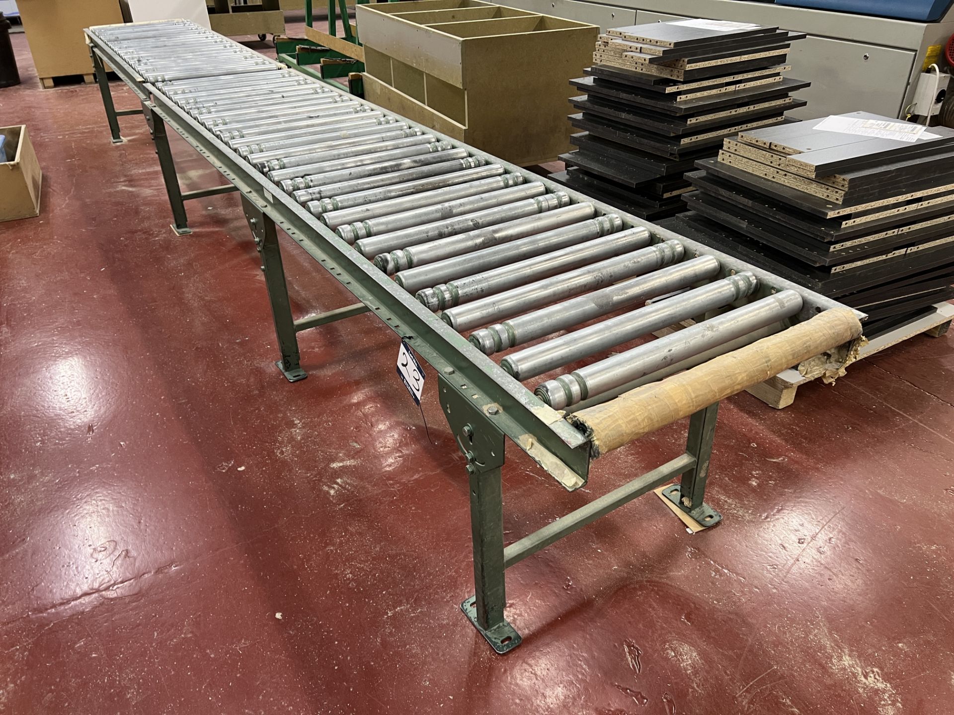 Roller conveyor with height adjustable legs, 600mm wide rollers x 5.2m long, height currently set at