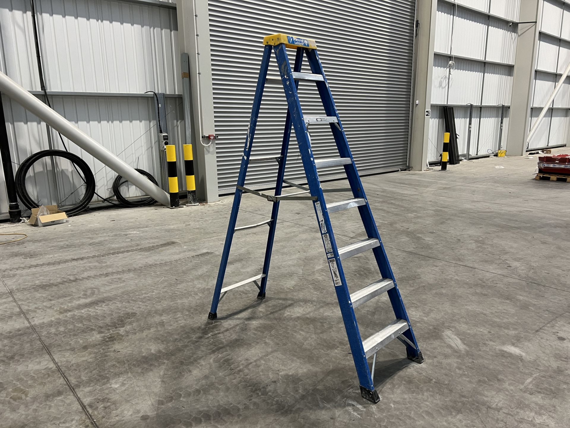 Clow Group fibreglass single 2.17m high 3 tread step ladder, maximum capacity 150 Kg. - Image 2 of 4