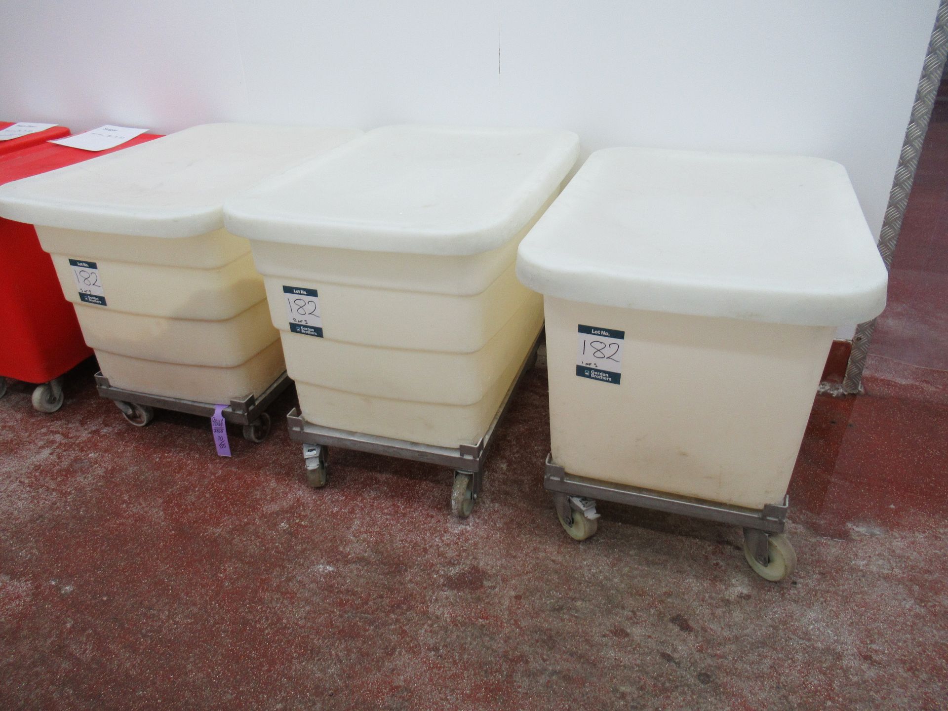 3 White plastic bins approximately 880 x 580 x 580mm deep on dollies with lids