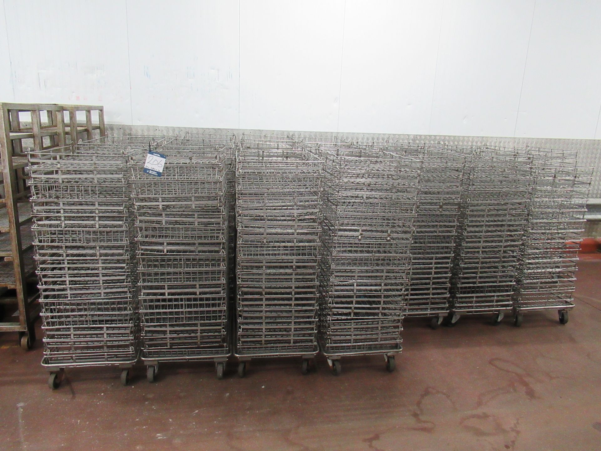 280 Stainless steel wire mesh stacking baskets, 800 x 520 x 75mm high, with 19 dollies