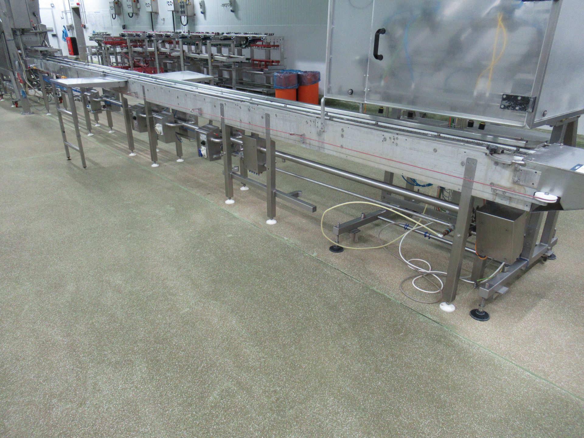 Proseal APC indexing chain conveyor Serial no: 1303, approximately 8m long, with adjustable tray