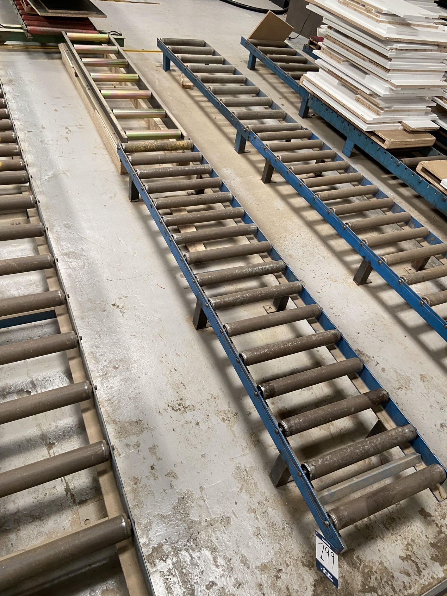 2 Section gravity roller conveyoring (1 section Axminster mounted on wooden blocks), total width