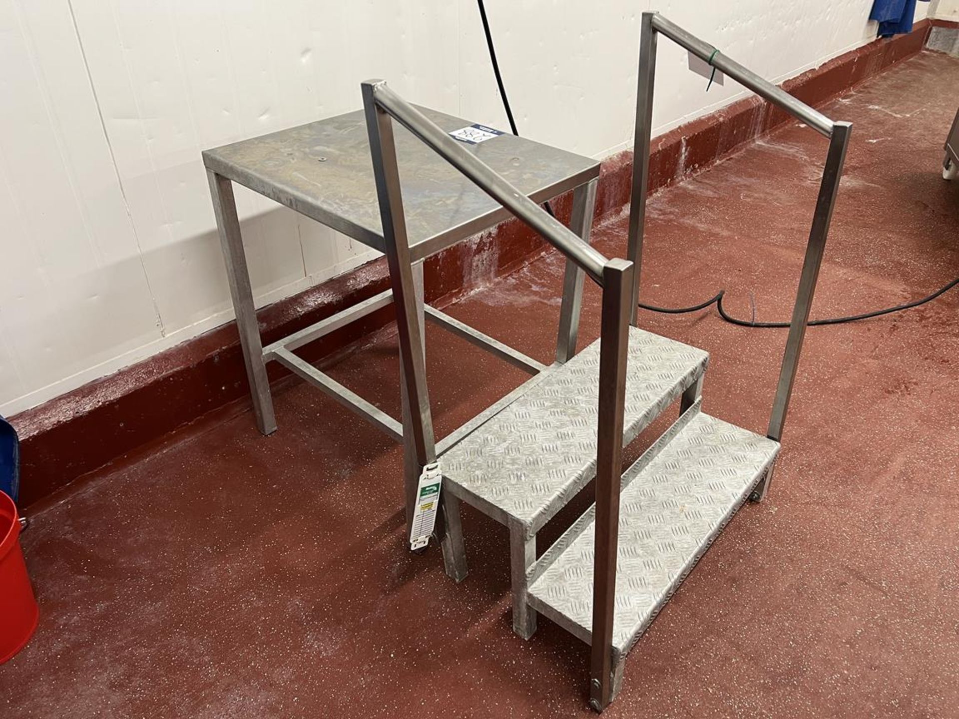 Stainless steel preparation table, measures approx. 700x600x850mm with 2x sets of steps