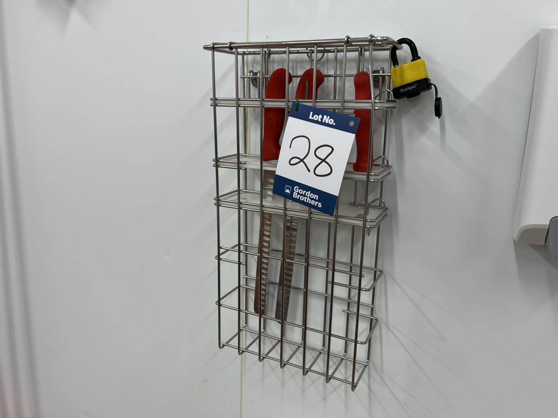 2x (no.) wall mounted stainless steel lockable knife safes with stainless steel cage shelf unit.