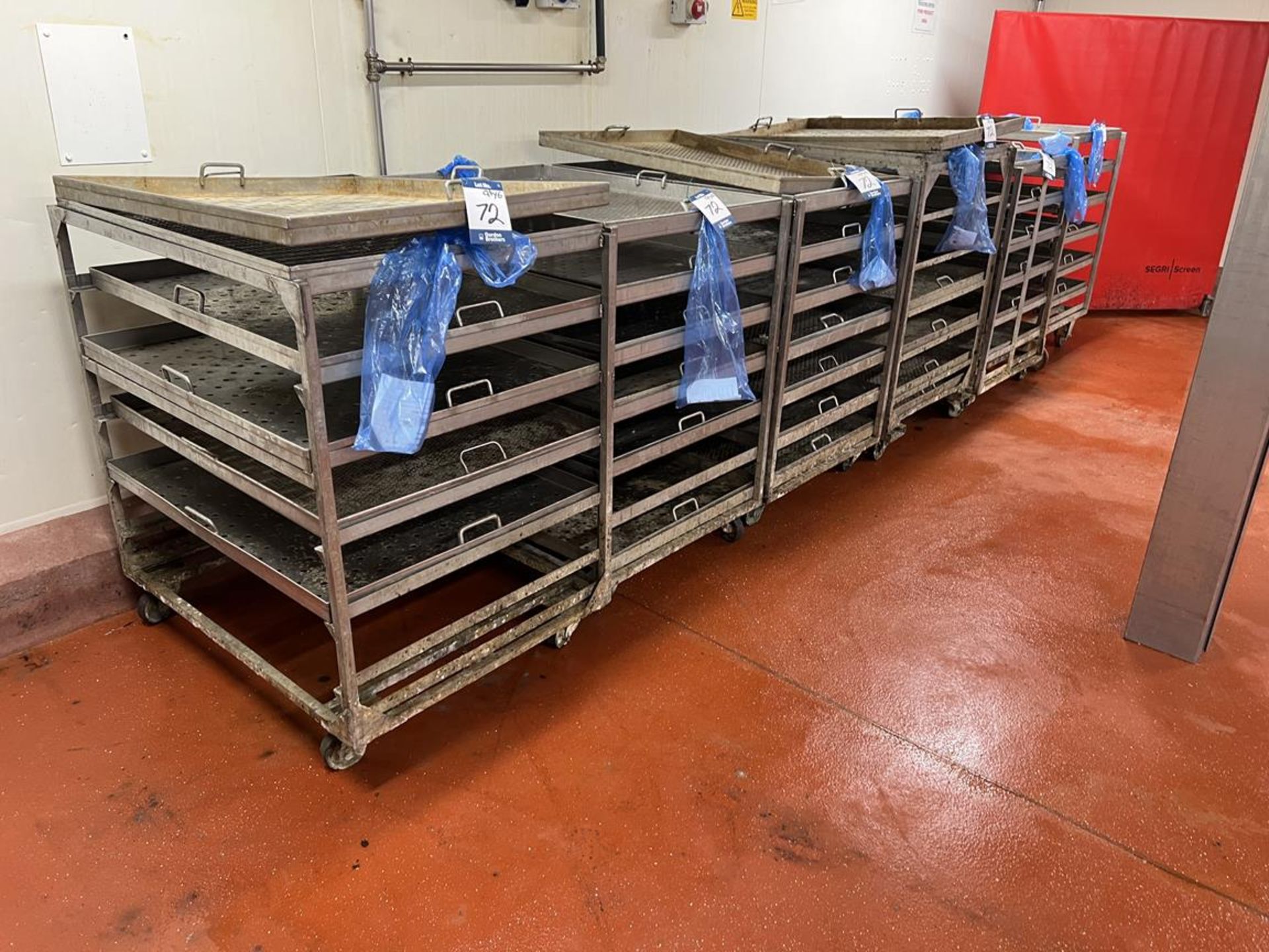 6x (no.) six/seven tier stainless steel product racks on wheels, size of removable trays 1030mm (