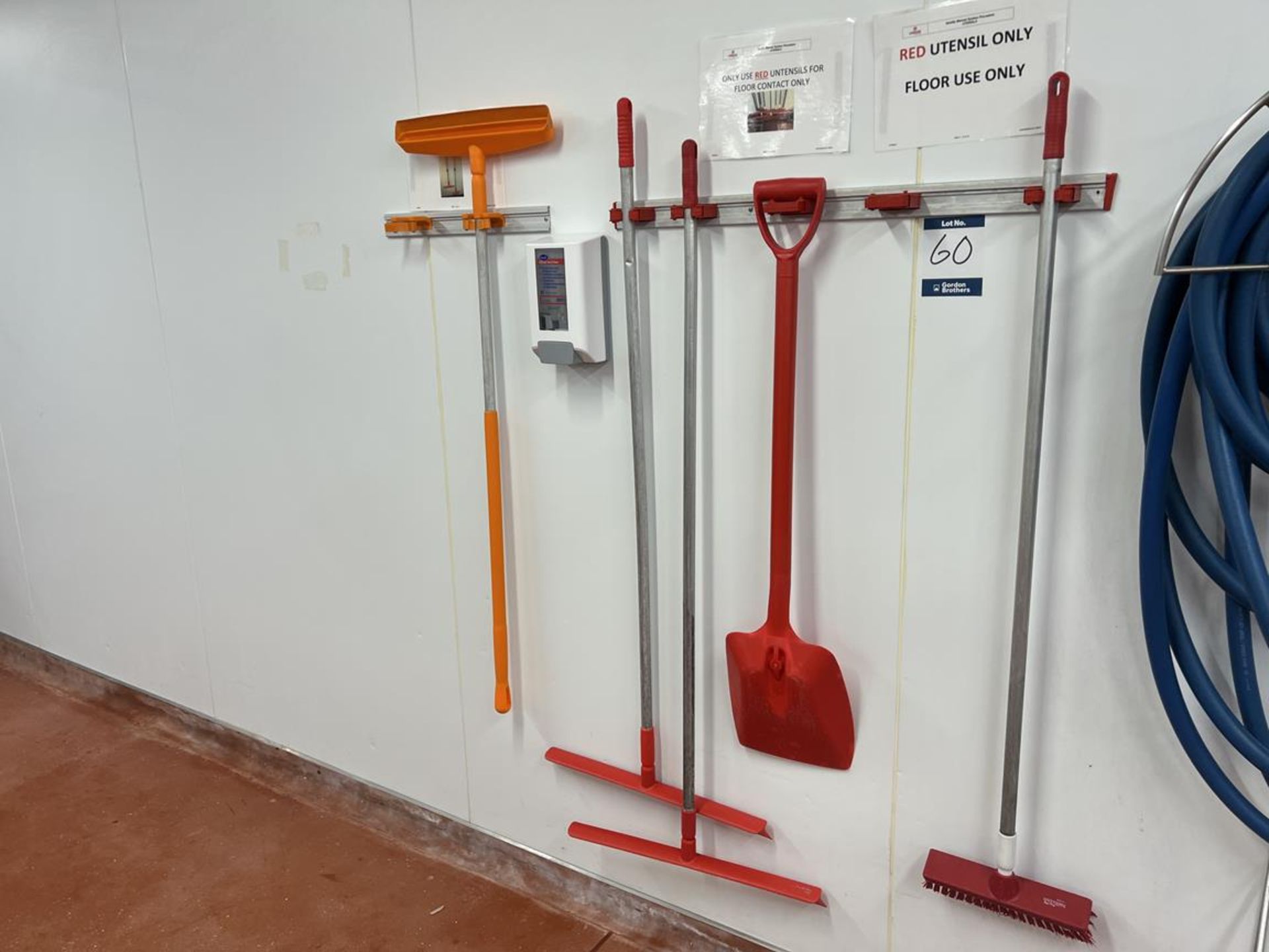 Wall mounted brush/mop stand