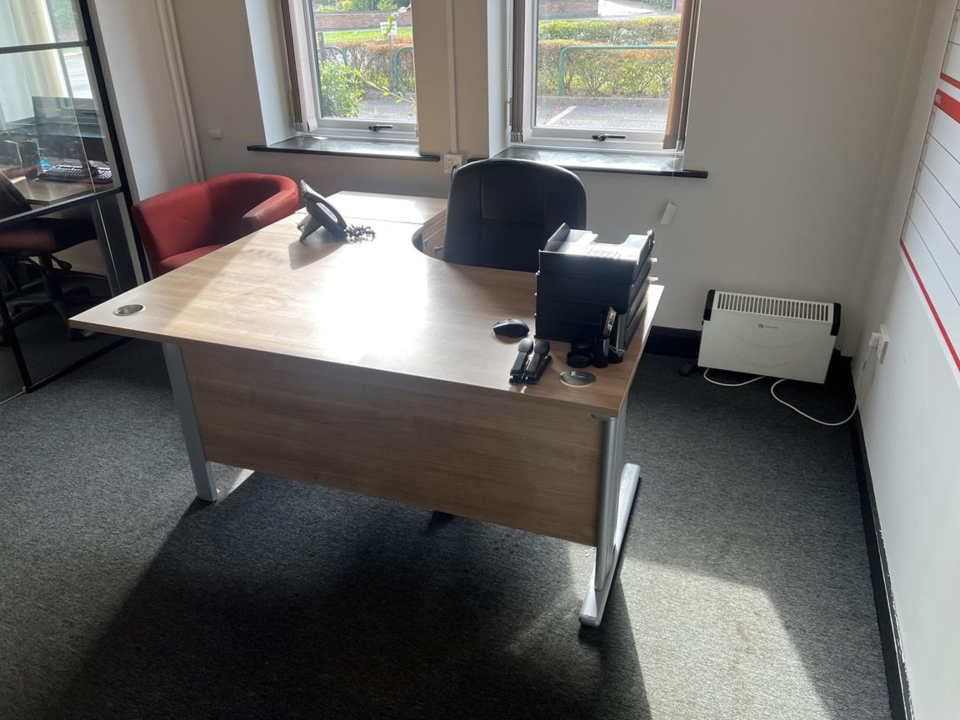 Furniture contents of the first ground floor office to include various laminated desks, swivel