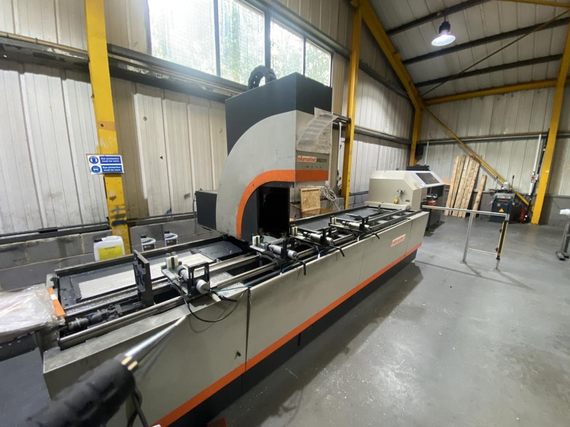 Elumatec model SBZ122/33 3 axis machining centre fitted with E550 controler, 4 position pneumatic