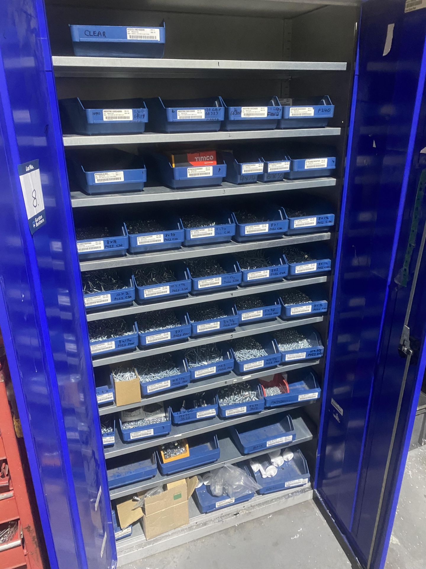 Double door steel cupboard complete with circa 40 lin bin storage units and fastners .