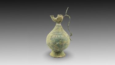 An Islamic Bronze Jug with Silver Inlay from the 12th Century Height: Approximately 31cm