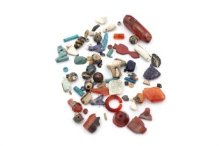 A Collection of Egyptian Beads. Contains: Glass Beads, Carnelian Beads, Lapis Lazuli Beads shaped a