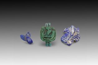 An Egyptian 3-Piece Amulet Set. Contains: Lapis Eye, Stamp, and Fly.