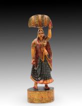 An Indian Wooden Painted Figure of a Woman Height: Approximately 37cm Length: Approximately 12cm