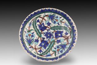 A Turkish Kutahya Glazed Pottery Plate from the 19th Century with a Beautiful Floral Design in Blue