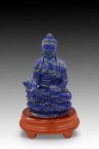 A Chinese Hand Carved Lapis Lazuli Buddhist Statue, Complete with a Wooden Stand. Height: Approxima