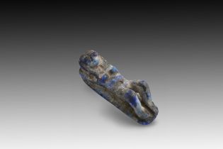 An Egyptian Lapis Lazuli Sculpture of a Reclining Woman, Possibly from the 19th Dynasty Length: App