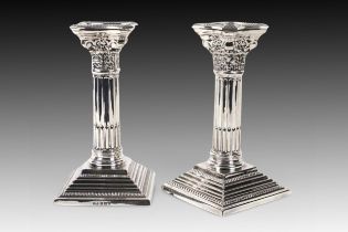 A Pair of 2 Birmingham Silver Candlesticks marked in 1963 Weight: 1025g Height: Approximately 16.6c