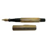 A Waterman Ideal lever fill fountain pen with a 9ct engine turned gold cap and barrel cover having