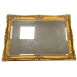 Large rectangular mirror with ornate gilt frame, 107cm x 76cm.