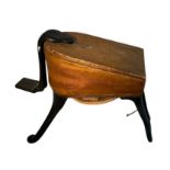 A leather and wooden foot bellow with iron feet. Height 31cm.