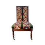 Mahogany chair with kilim upholstery on turned legs with brass casters to front, height 87cm.