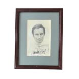 Charlton Heston (1923-2008) – A framed black and white photograph signed by Charlton Heston in black