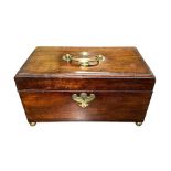 A mahogany hinged-lid tea caddy on four brass round ball feet. Three compartments, brass handle on