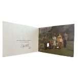 A 1968 Christmas Card sent from Queen Elizabeth II. Twin Royal ciphers to cover, photograph of the